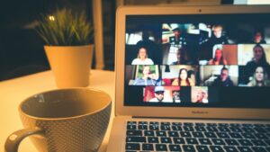 macbook air displaying woman in white shirt