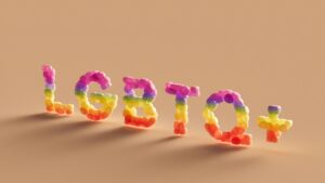 a word made out of plastic letters on a brown background