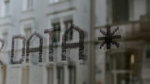 a close up of a window with a building in the background