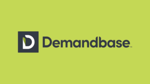 Demandbase logo featuring a stylized "D" inside a dark square next to the word "Demandbase" on a light green background, as seen in work from fastest-growing agencies like Lesniak Swann in the UK.