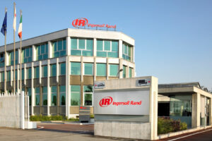 The exterior of an Ingersoll Rand office building, featuring signs with the company logo and a clear sky, reflects the brand's commitment to innovation through AI-powered personalisation and advanced lead nurturing solutions.