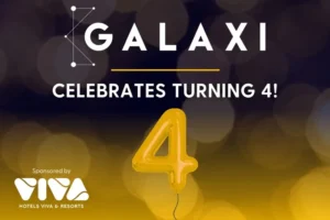 A graphic with the text “GALAXI CELEBRATES TURNING 4!” features a yellow balloon shaped like the number 4 and a sponsorship mention from Viva Hotels & Resorts.