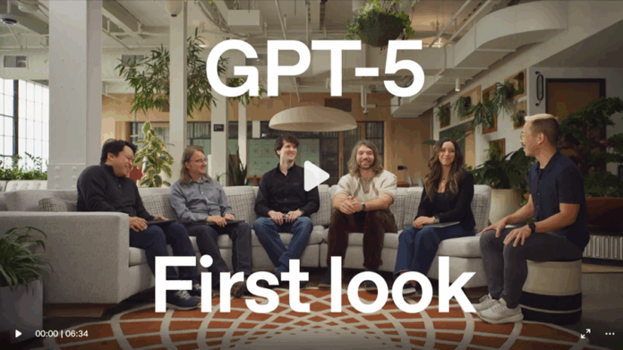 CHatGPTV5-Launch-900x506px Six people sit on couches in a modern office space, with "ChatGPT-5 First look" text overlaid on the image—a video play bar appears at the bottom, hinting at exciting new tools for B2B marketers.